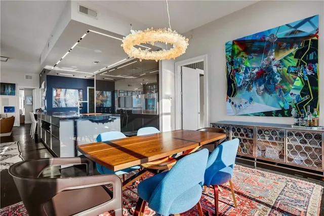 a bathroom with a double vanity sink toilet and shower