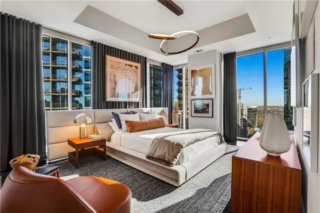 a large kitchen with stainless steel appliances granite countertop a sink and a refrigerator