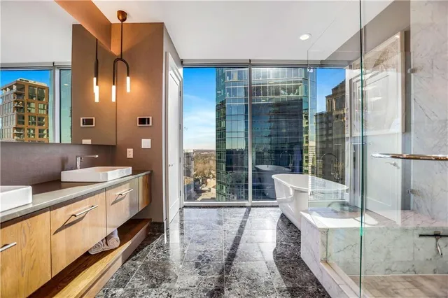 a bathroom with a toilet a sink and a mirror