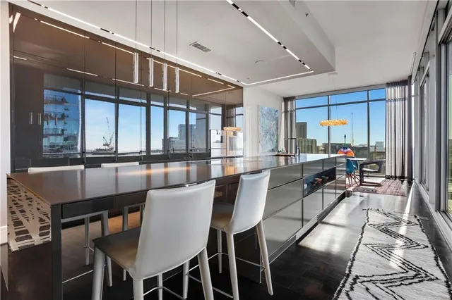 a view of a room with shelves and windows
