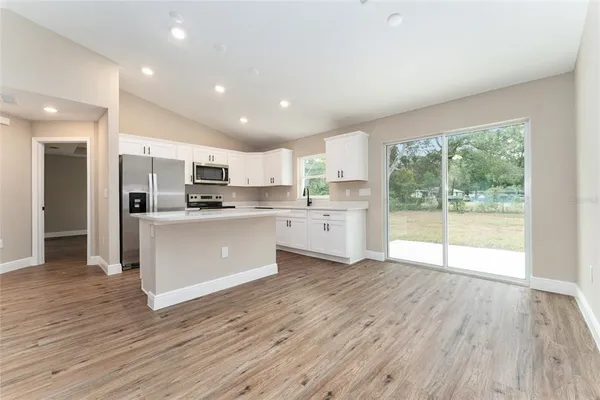 a view of kitchen with wooden floor