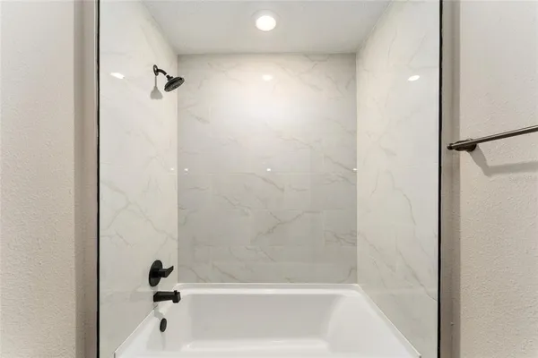 a close view of a bathtub in bathroom