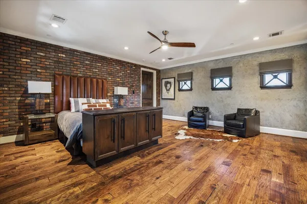 a spacious bathroom with a granite countertop sink and a large mirror