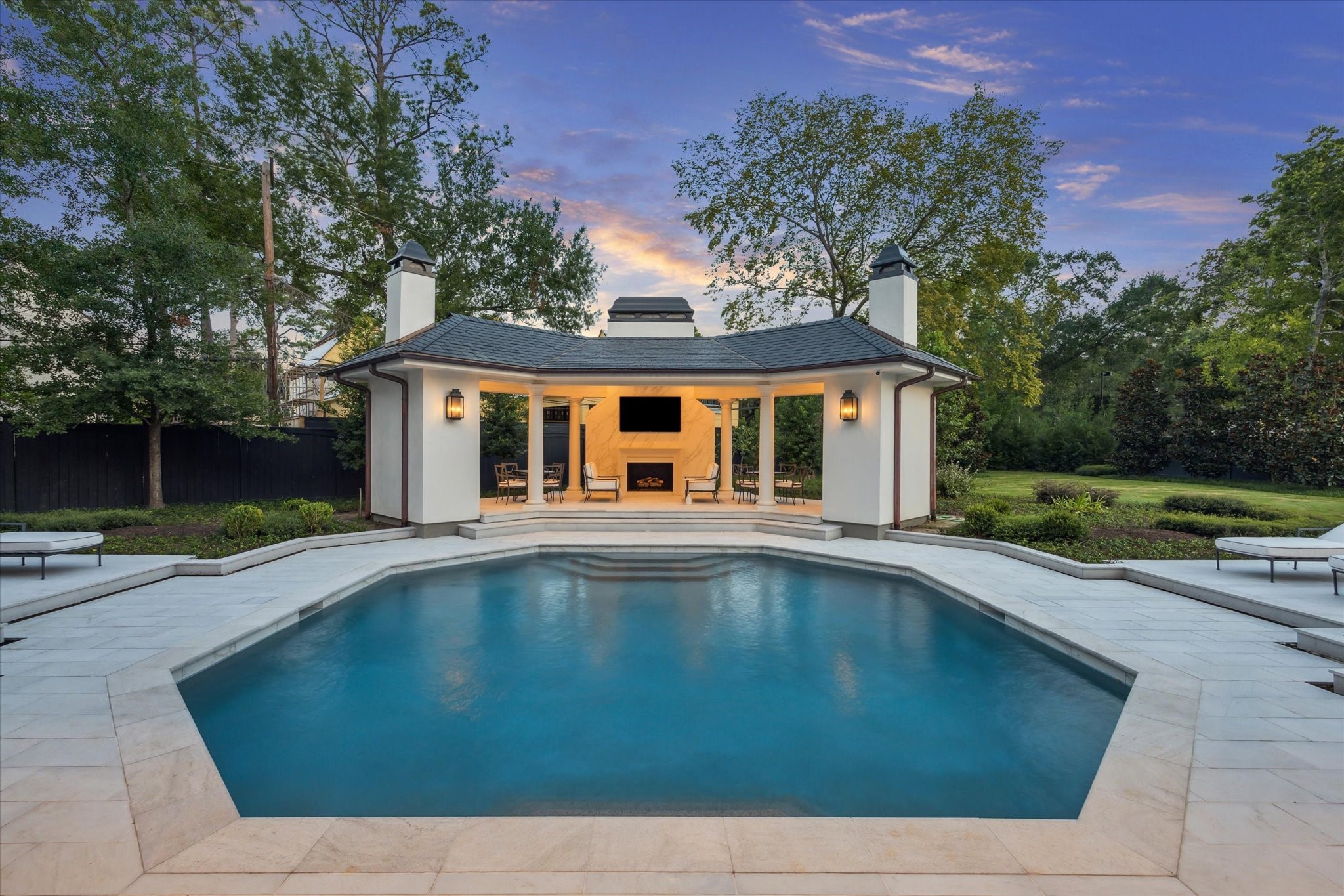 11095 Memorial Drive Houston, TX 77024 - Photo 3 of 48 a front view of a house with yard swimming pool and outdoor seating