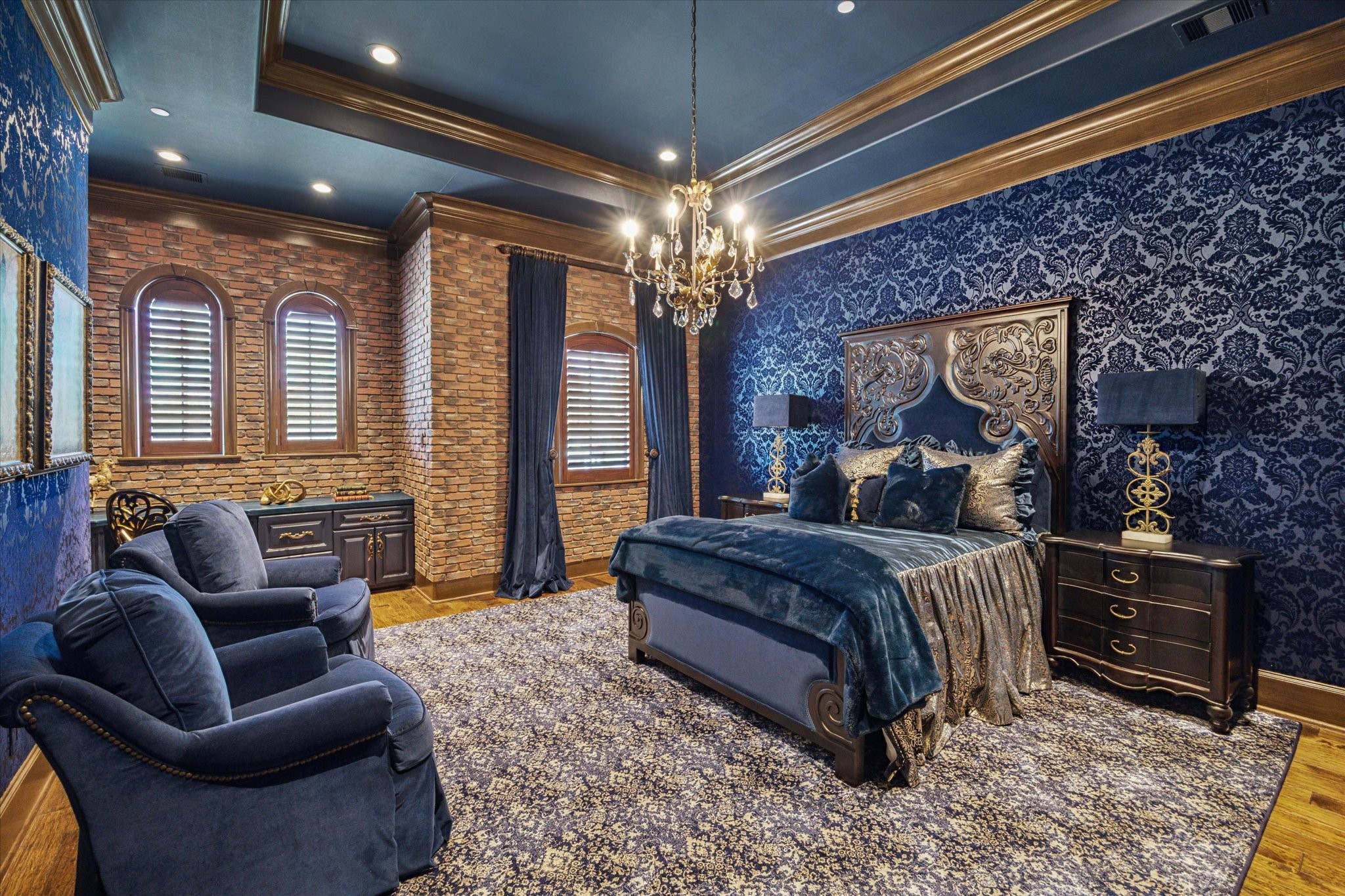 11095 Memorial Drive Houston, TX 77024 - Photo 34 of 48 a spacious bedroom with a bed a couch and chandelier