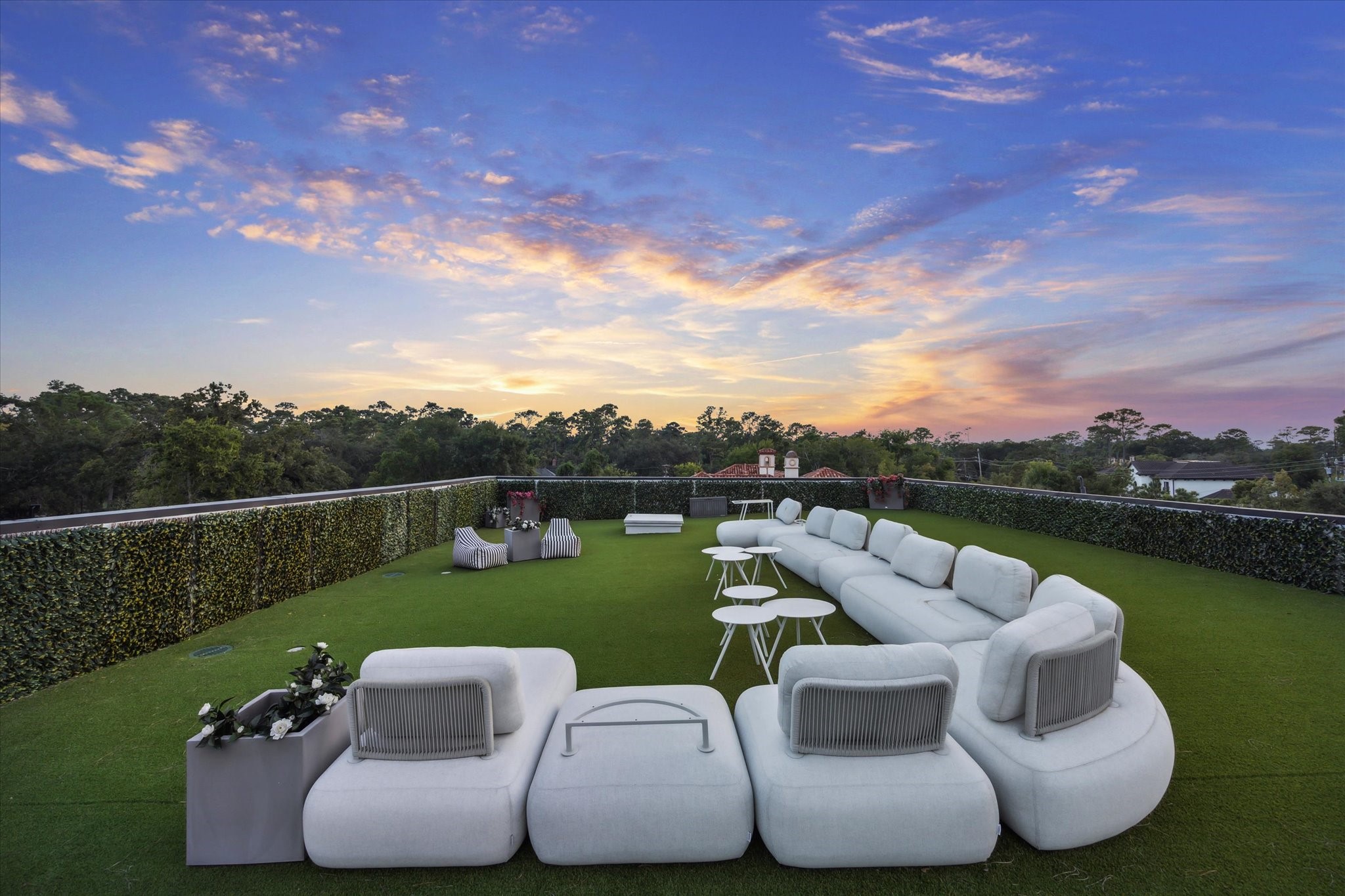 11095 Memorial Drive Houston, TX 77024 - Photo 4 of 48 A rare highlight of this home, the rooftop entertainment lounge offers a one-of-a-kind outdoor living space, framed by lush treetop views and an unrivaled setting for gatherings under the stars.