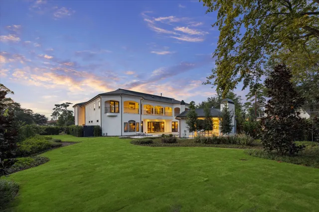 an aerial view of a house with outdoor space pool seating area and yard