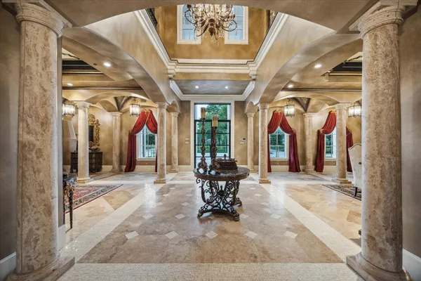 a view of a hallway with chairs
