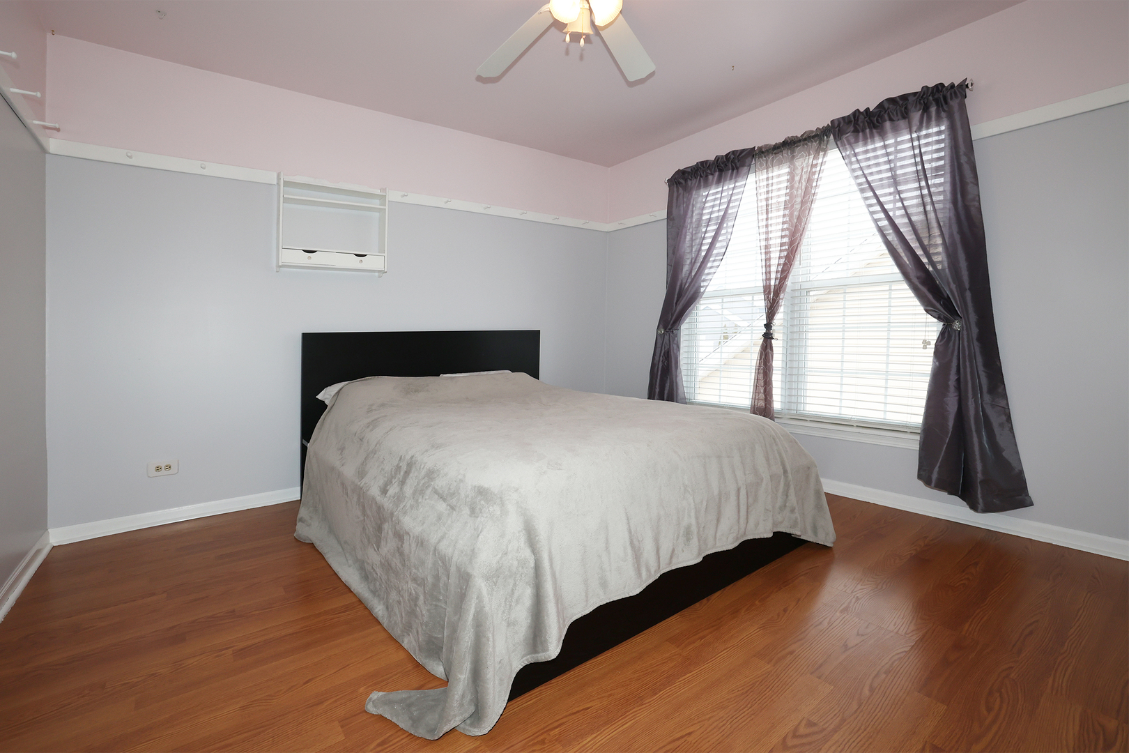 1675 Kautz Road Aurora, IL 60504 - Photo 22 of 57 a bed sitting in a bedroom next to a window