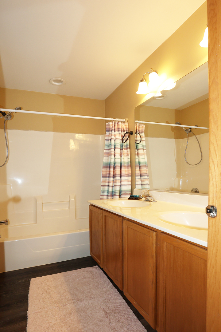 1675 Kautz Road Aurora, IL 60504 - Photo 27 of 57 a bathroom with a sink a toilet and a shower