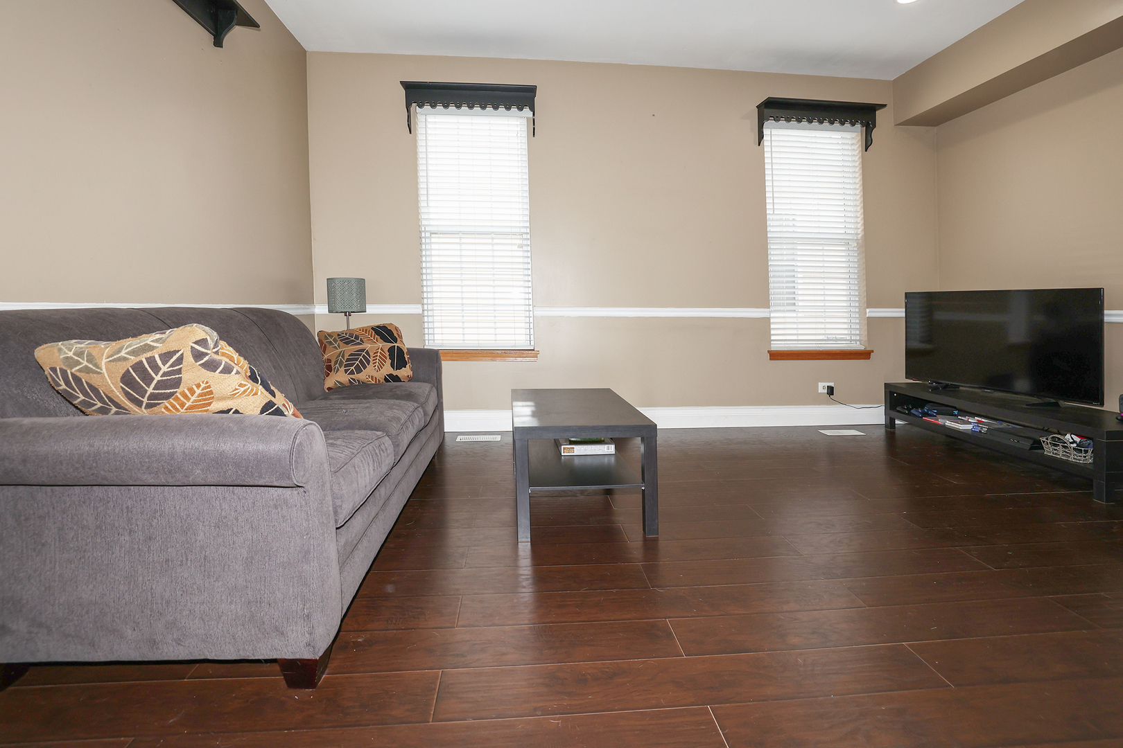 1675 Kautz Road Aurora, IL 60504 - Photo 36 of 57 a living room with furniture and a flat screen tv