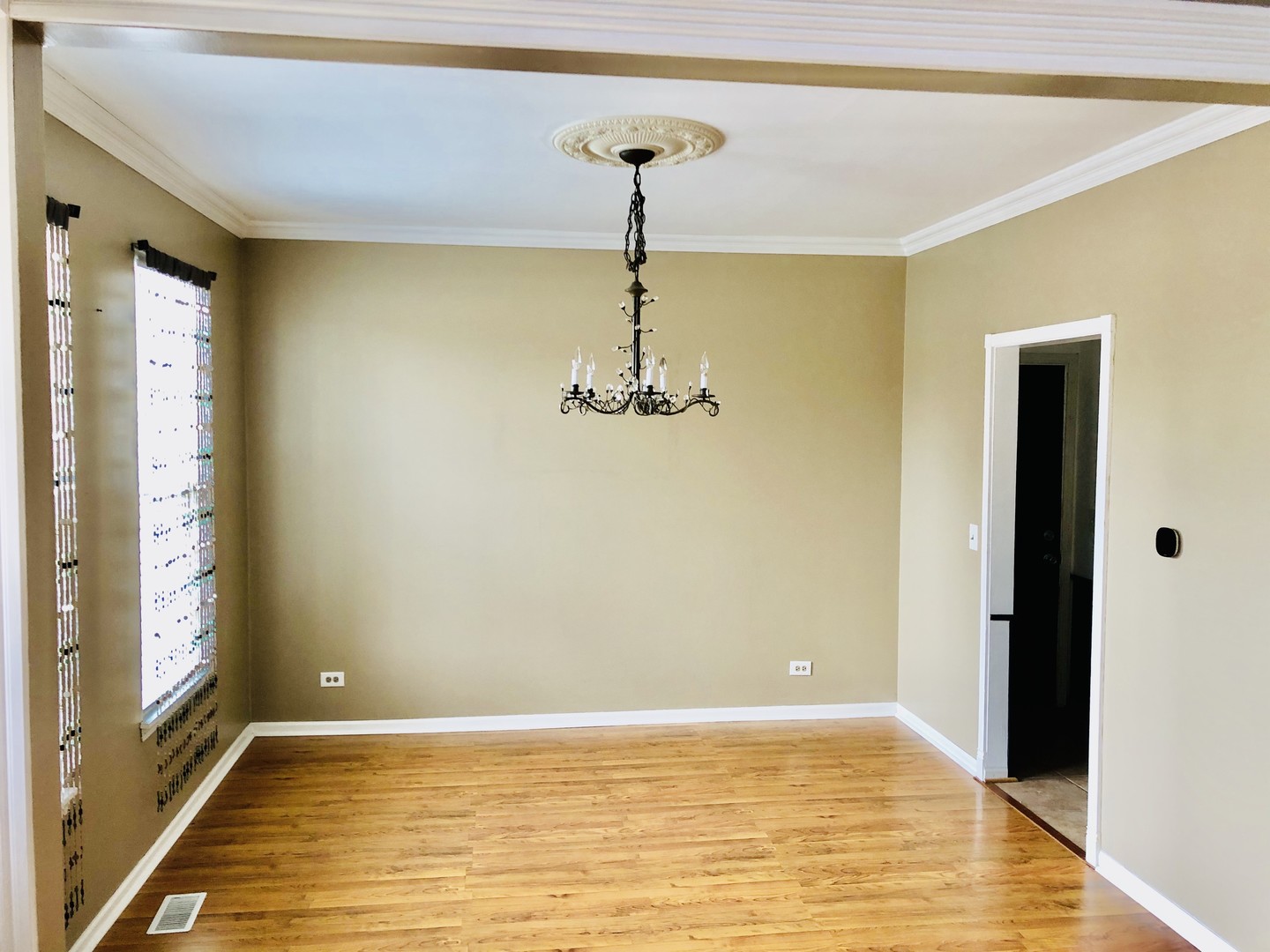 1675 Kautz Road Aurora, IL 60504 - Photo 5 of 57 a view of an empty room with window and wooden floor