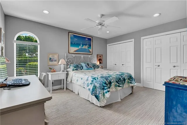 a bedroom with a bed and a table