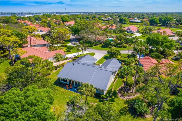 an aerial view of residential house with outdoor space and swimming pool