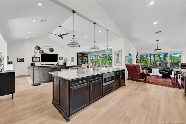 a kitchen with stainless steel appliances granite countertop a stove oven and a refrigerator