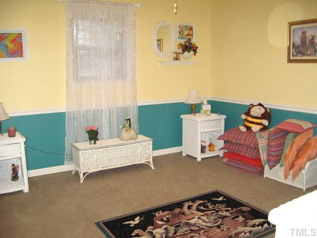 3817 Cheek Road Durham, NC 27704 - Photo 11 of 18 One of three additional bedrooms, each with a ceiling fan Bedroom