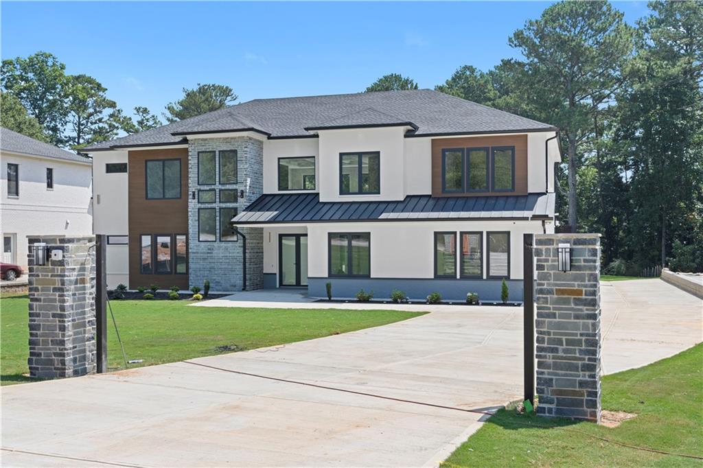 670 Moon Place Road Lawrenceville, GA 30044 - Photo 1 of 1 a front view of house with yard and green space