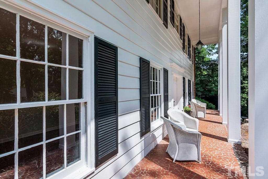 4408 Pamlico Drive Raleigh, NC 27609 - Photo 2 of 20 a view of a balcony with a potted plant and a glass door