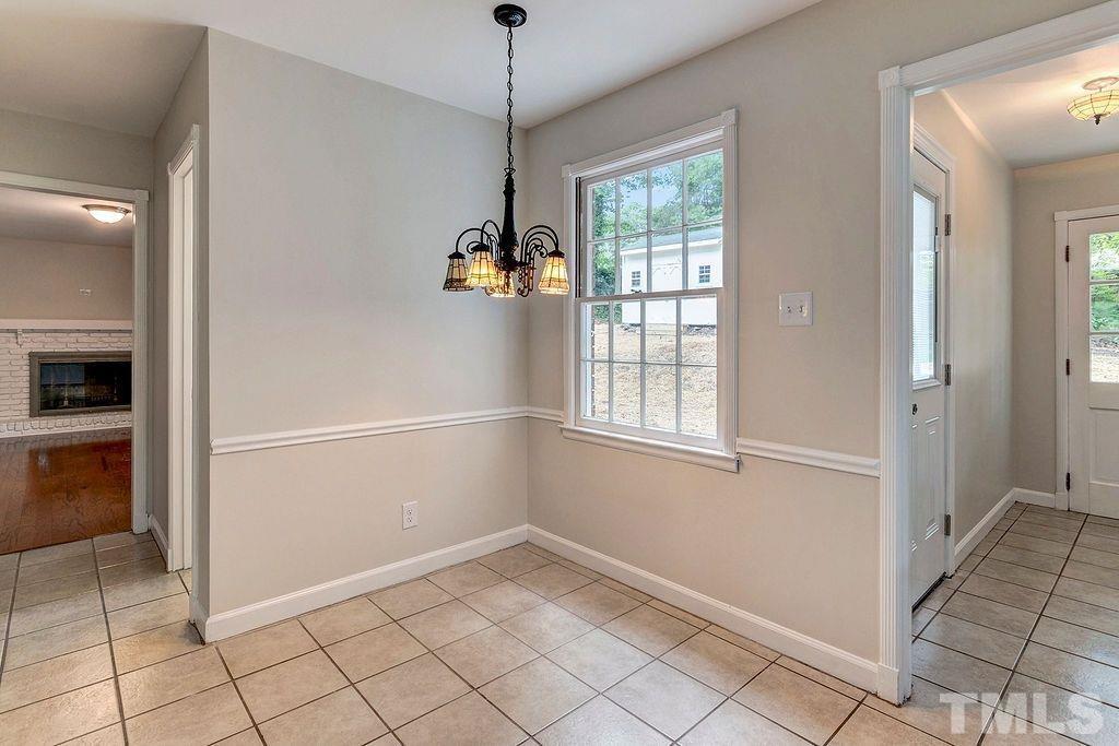 4408 Pamlico Drive Raleigh, NC 27609 - Photo 11 of 20 a view of an empty room with a window