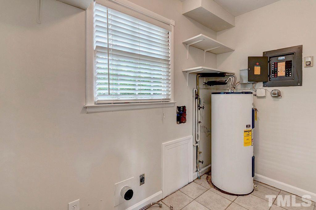 4408 Pamlico Drive Raleigh, NC 27609 - Photo 13 of 20 a bathroom with a shower and a window