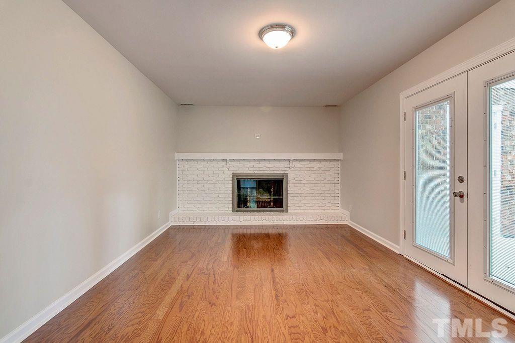 4408 Pamlico Drive Raleigh, NC 27609 - Photo 14 of 20 wooden floor in an empty room with a window