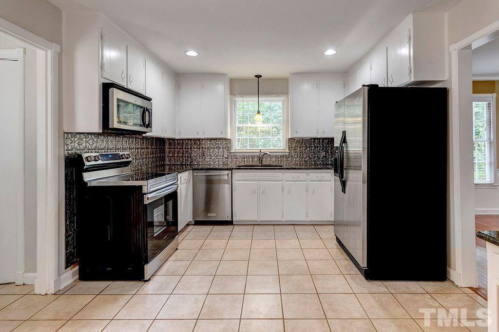 4408 Pamlico Drive Raleigh, NC 27609 - Photo 7 of 20 a kitchen with a sink a stove and refrigerator