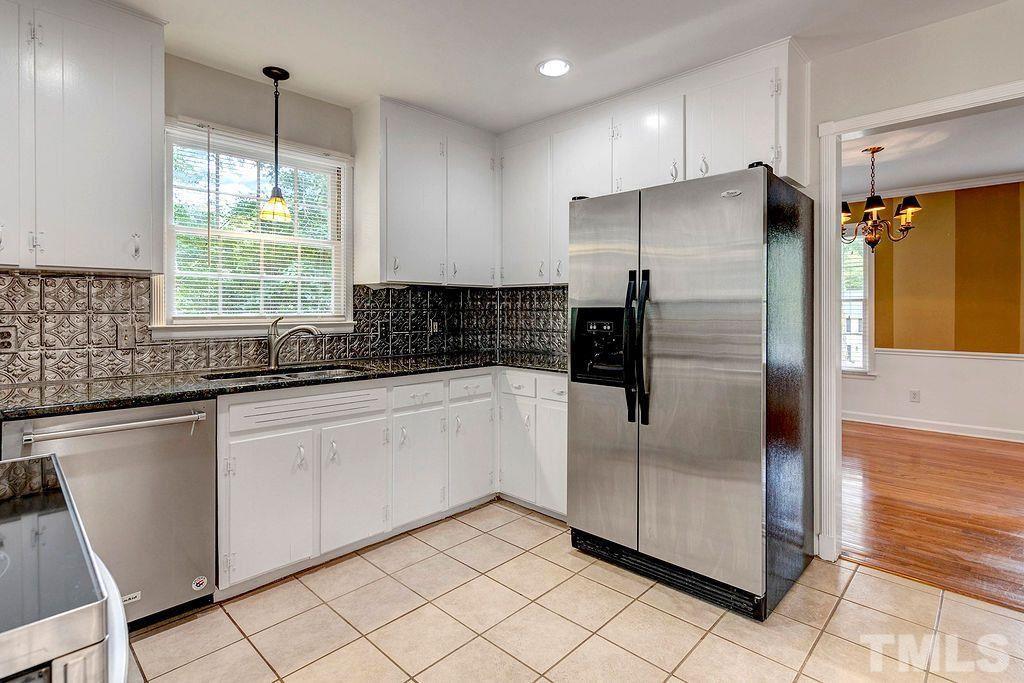 4408 Pamlico Drive Raleigh, NC 27609 - Photo 8 of 20 a kitchen with granite countertop a refrigerator and a sink