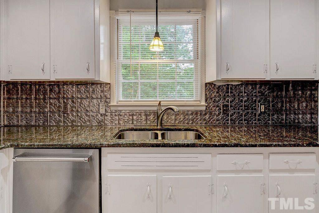 4408 Pamlico Drive Raleigh, NC 27609 - Photo 10 of 20 a kitchen with a sink and cabinets