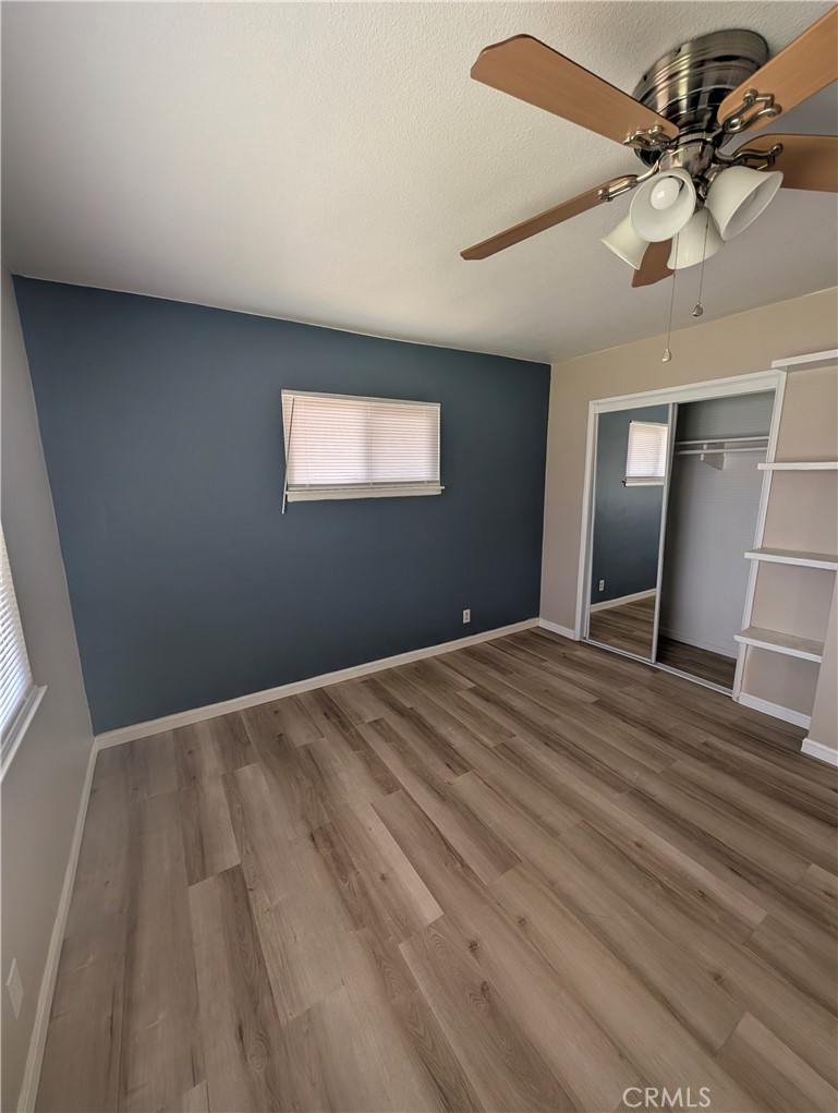 8641 Garfield Street Riverside, CA 92504 - Photo 6 of 19 a view of empty room with wooden floor