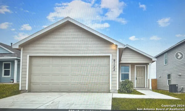 a front view of a house with a garage