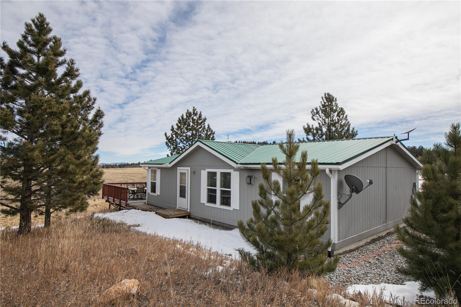 143 Sombrero Road Hartsel, CO 80449 - Photo 1 of 25 a front view of a house with garden