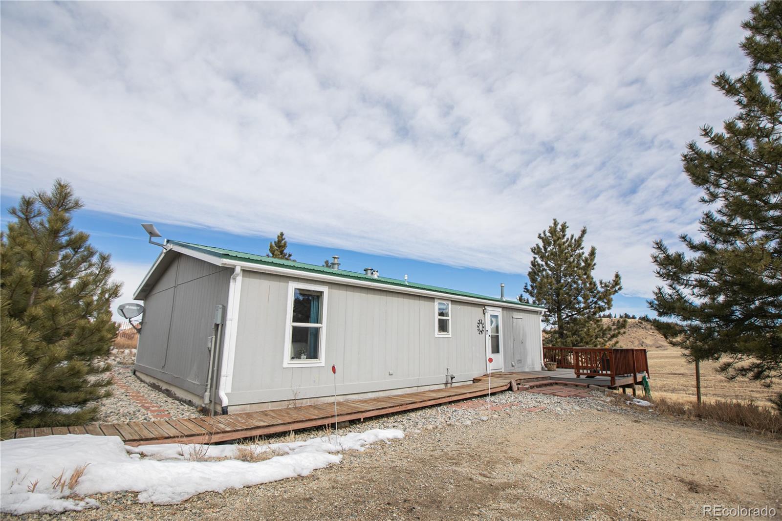 143 Sombrero Road Hartsel, CO 80449 - Photo 17 of 25 a house with a covered with snow in front of it