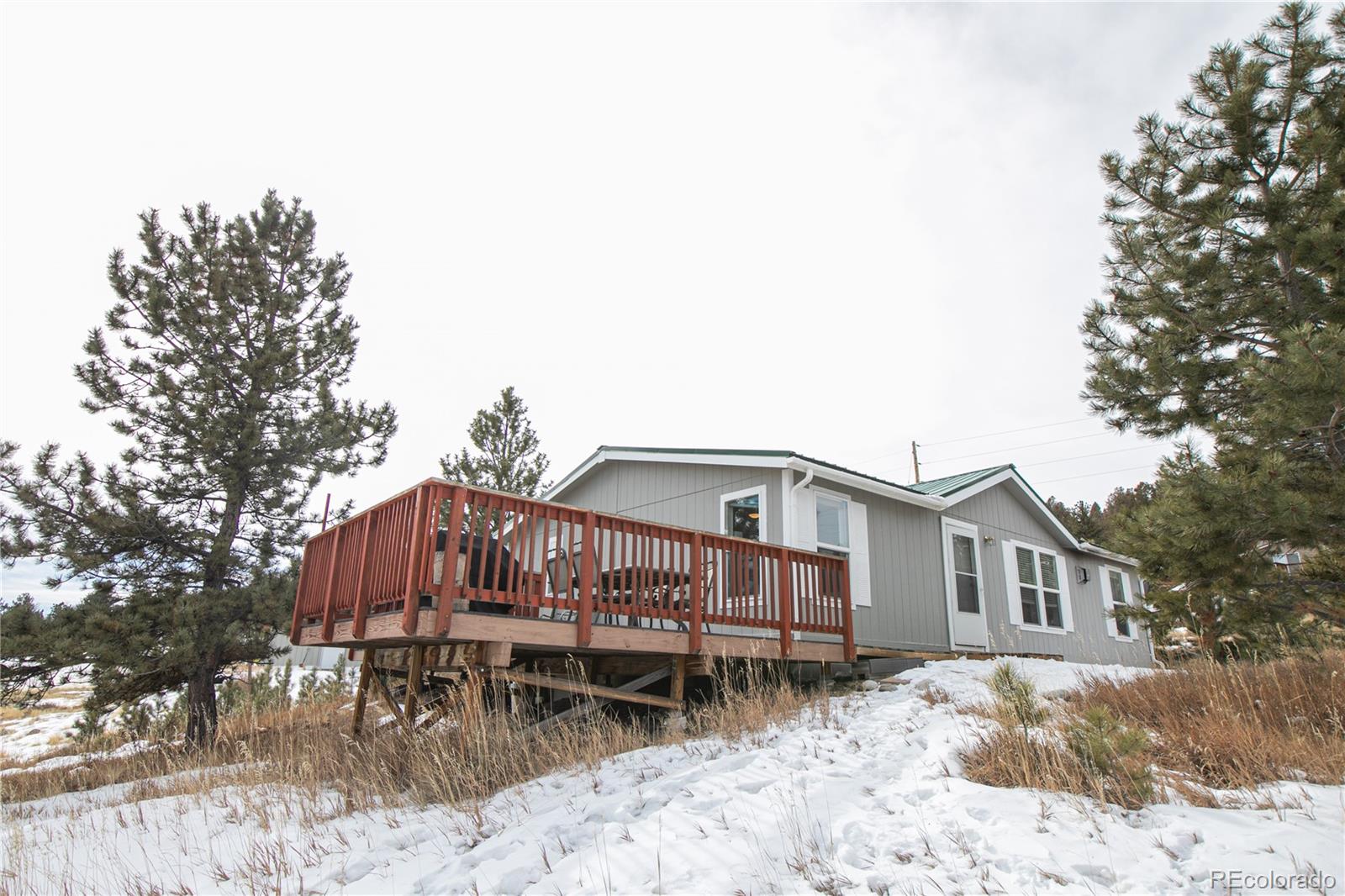 143 Sombrero Road Hartsel, CO 80449 - Photo 19 of 25 a backyard of a house with table and chairs