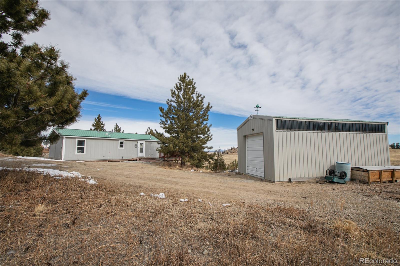 143 Sombrero Road Hartsel, CO 80449 - Photo 24 of 25 a view of a house with a yard and large tree