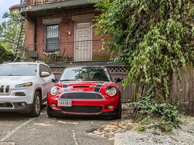 a front view of a house with parking space