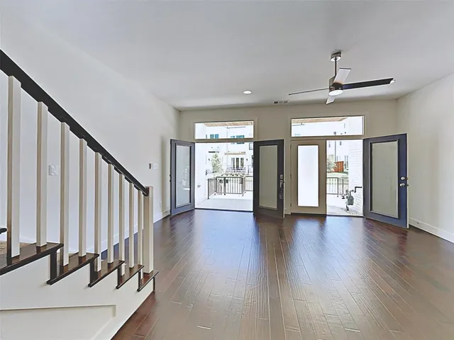 a view of an entryway with wooden floor and door