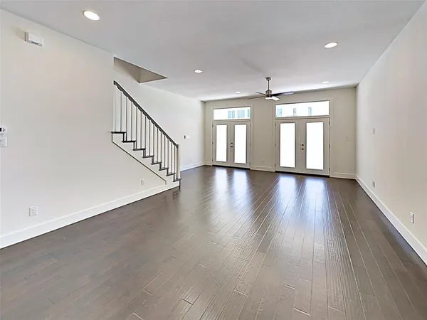 a view of an entryway with wooden floor