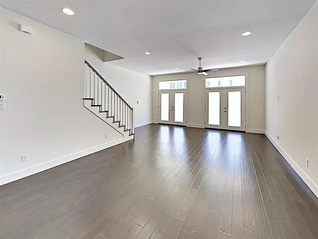 a view of an entryway with wooden floor