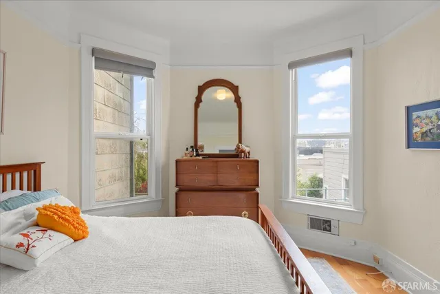 a bathroom with a toilet sink and a mirror