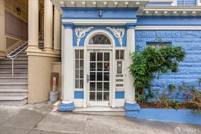 a bedroom with furniture and a book shelf