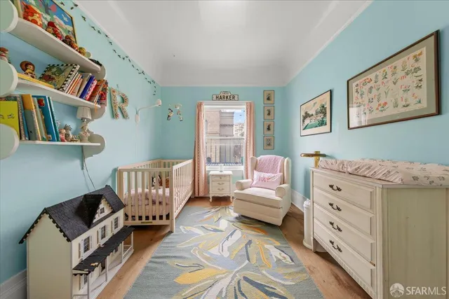 a living room with fireplace furniture and a window