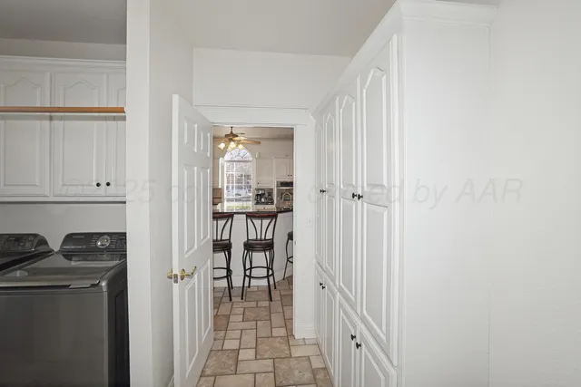 a view of a kitchen from the hallway