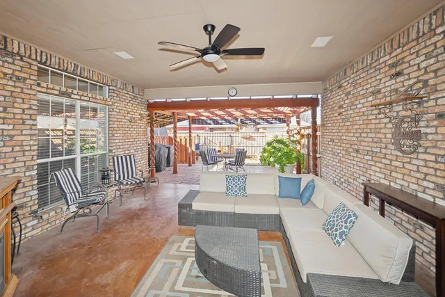 a view of living room with furniture and a large window