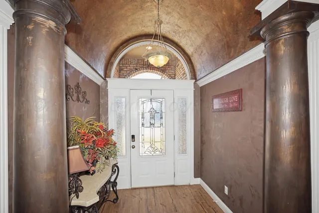 a view of entryway with wooden floor