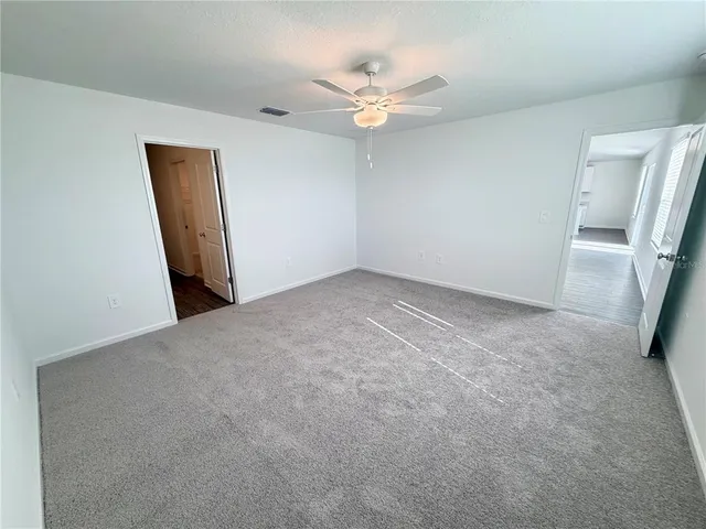 a bathroom with a tub shower vanity and a sink