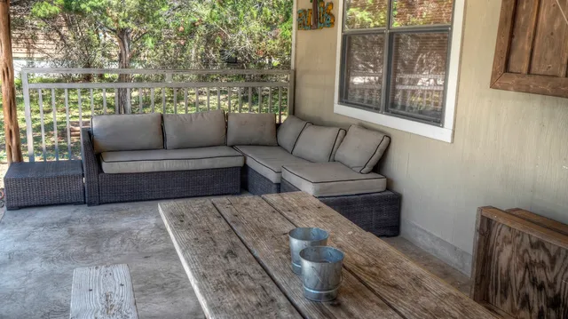 a living room with furniture and a window
