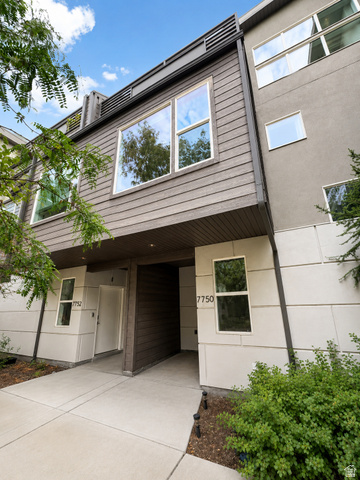 7750 Rooftop Drive Midvale, UT 84047 - Photo 1 of 8 Contemporary multi-level exterior with horizontal wood-finish siding and stucco accents