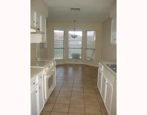a bathroom with a double vanity sink and a bathtub