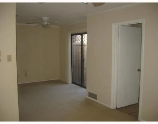 a view of empty room with windows