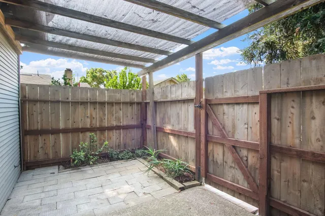 a backyard with wooden fence